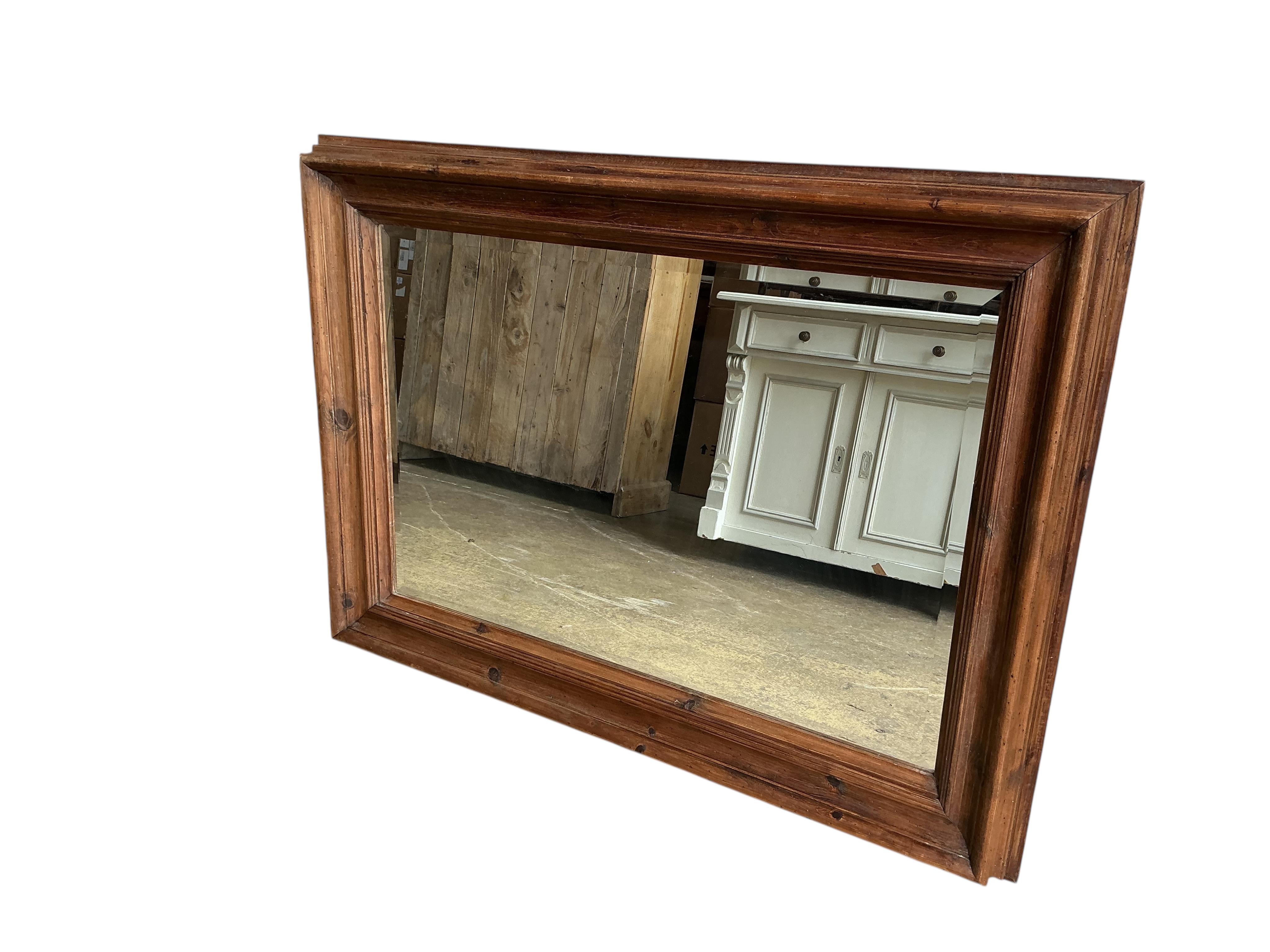 A rectangular pine overmantel mirror, width 114cm, height 82cm